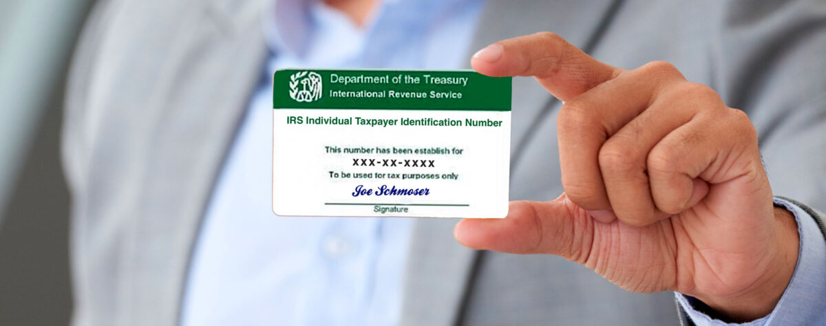 Business-man-holding-ITIN-number